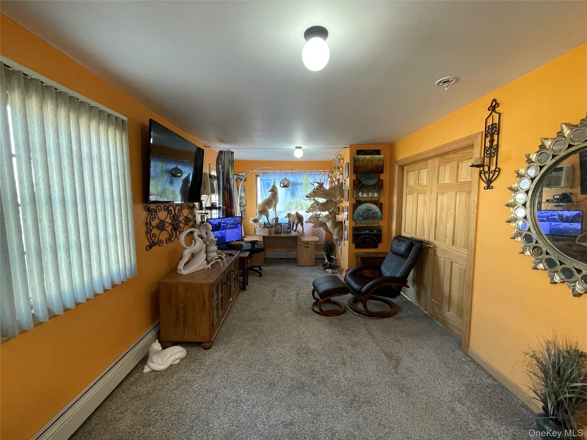 104 Ostend Road Island Park, NY 11558 - Photo 37 of 42 a room with furniture and a chair