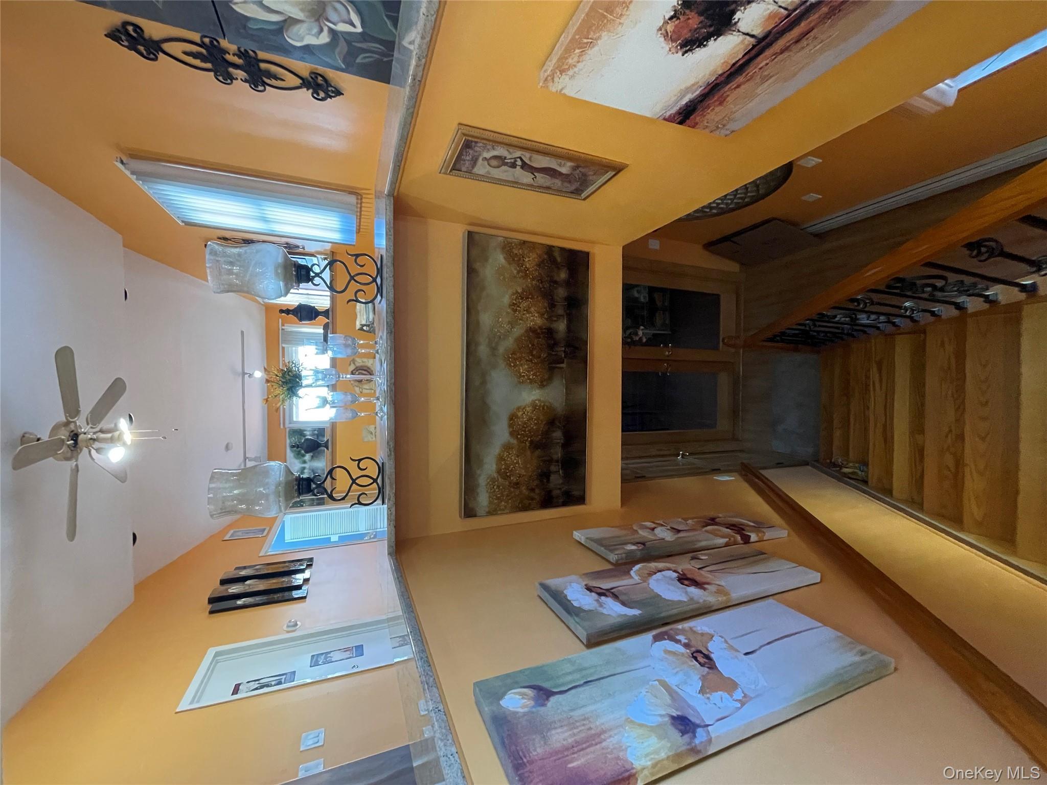 104 Ostend Road Island Park, NY 11558 - Photo 38 of 42 a living room with furniture and a fireplace