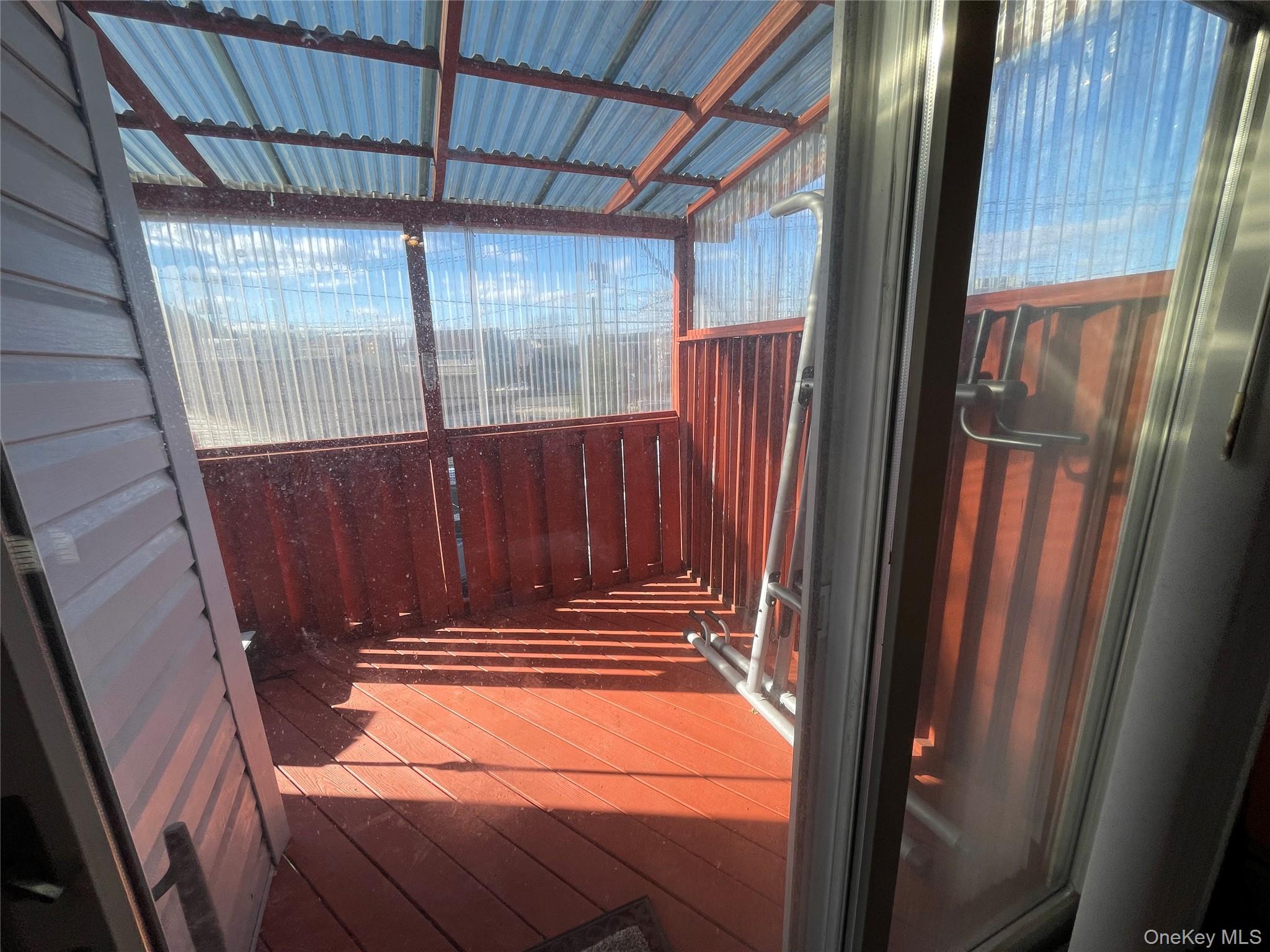 104 Ostend Road Island Park, NY 11558 - Photo 41 of 42 view of room with stairs and wooden floor