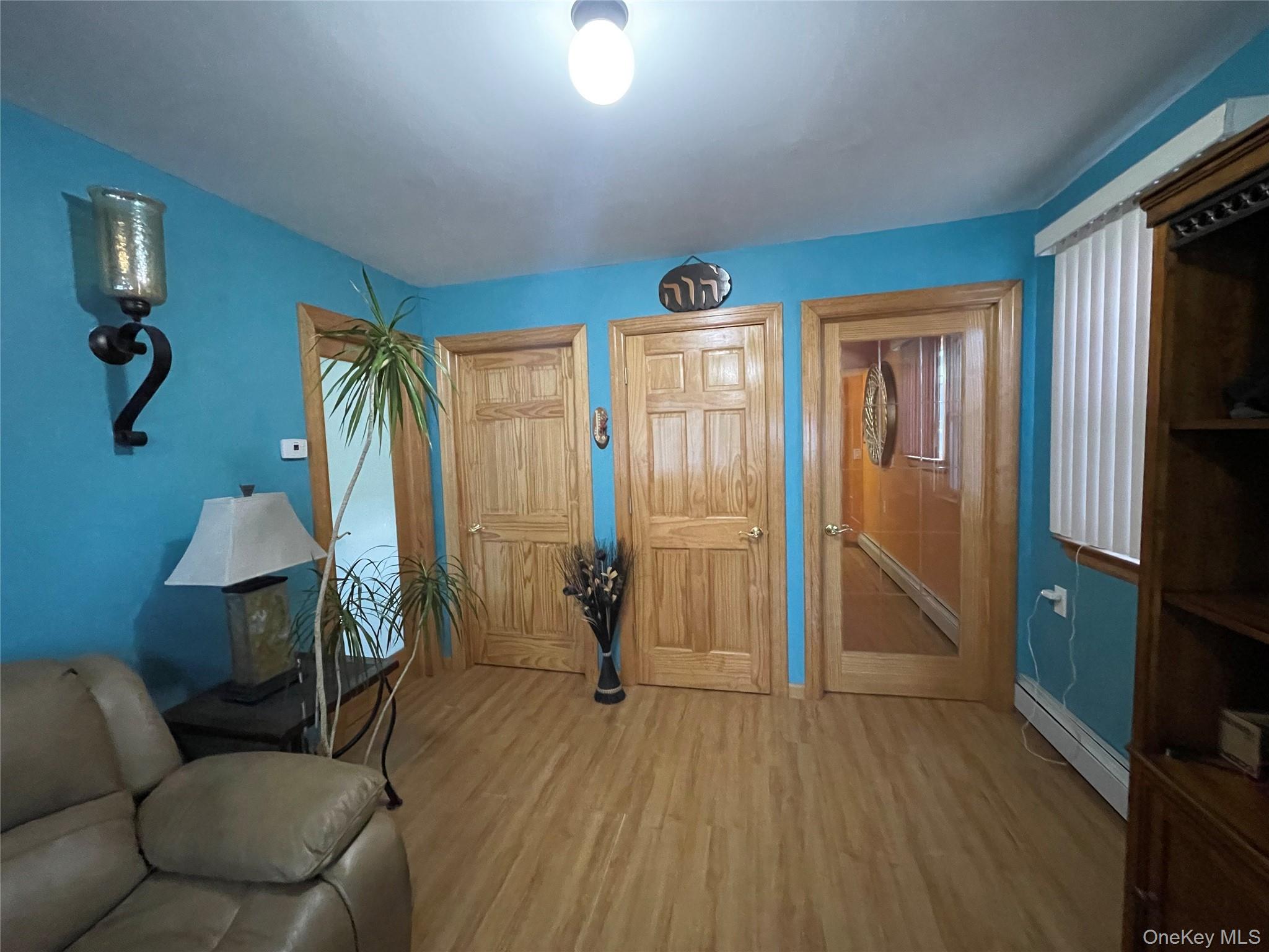 104 Ostend Road Island Park, NY 11558 - Photo 8 of 42 a livingroom with furniture and a window