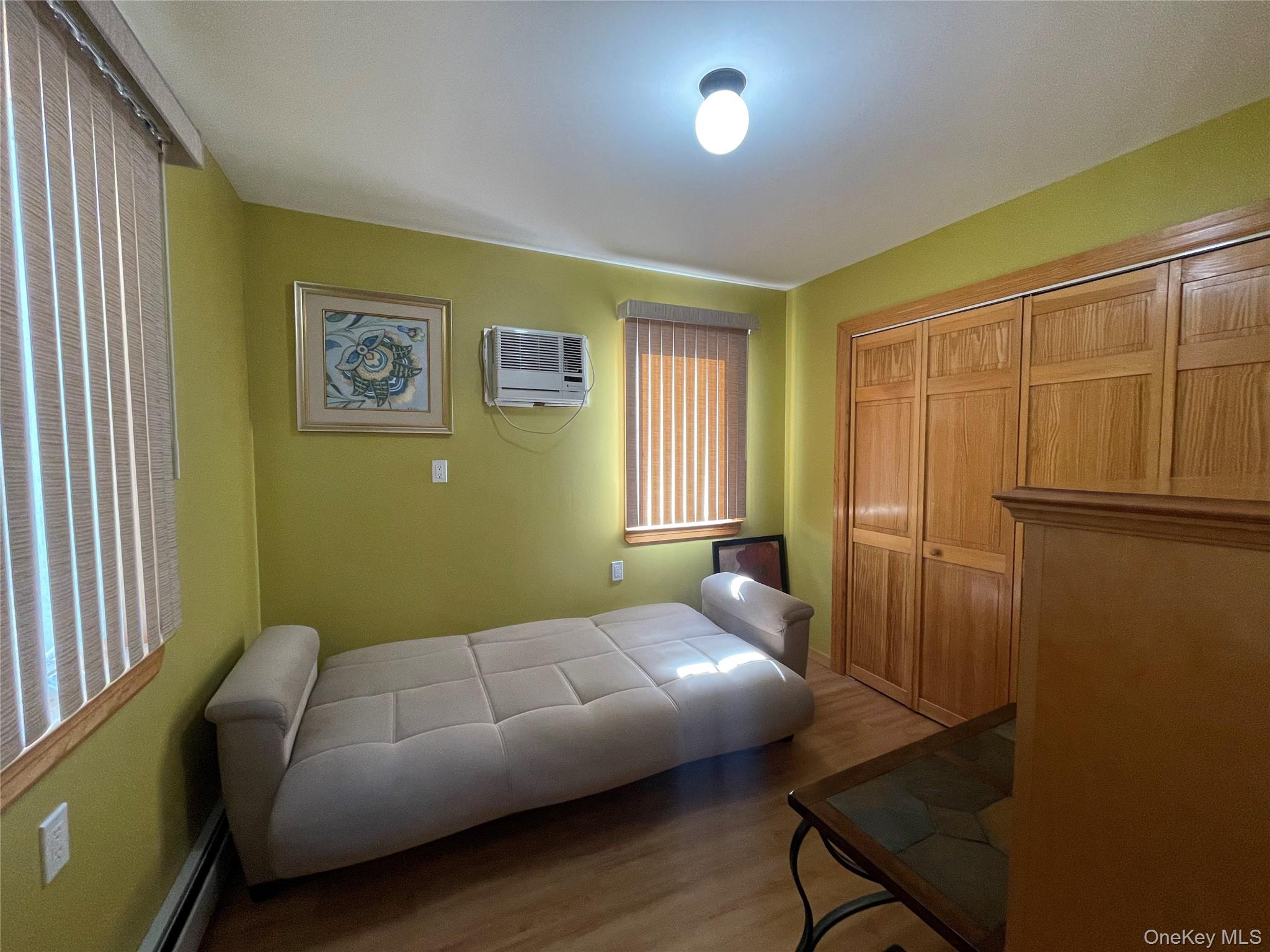 104 Ostend Road Island Park, NY 11558 - Photo 9 of 42 a living room with furniture and a window