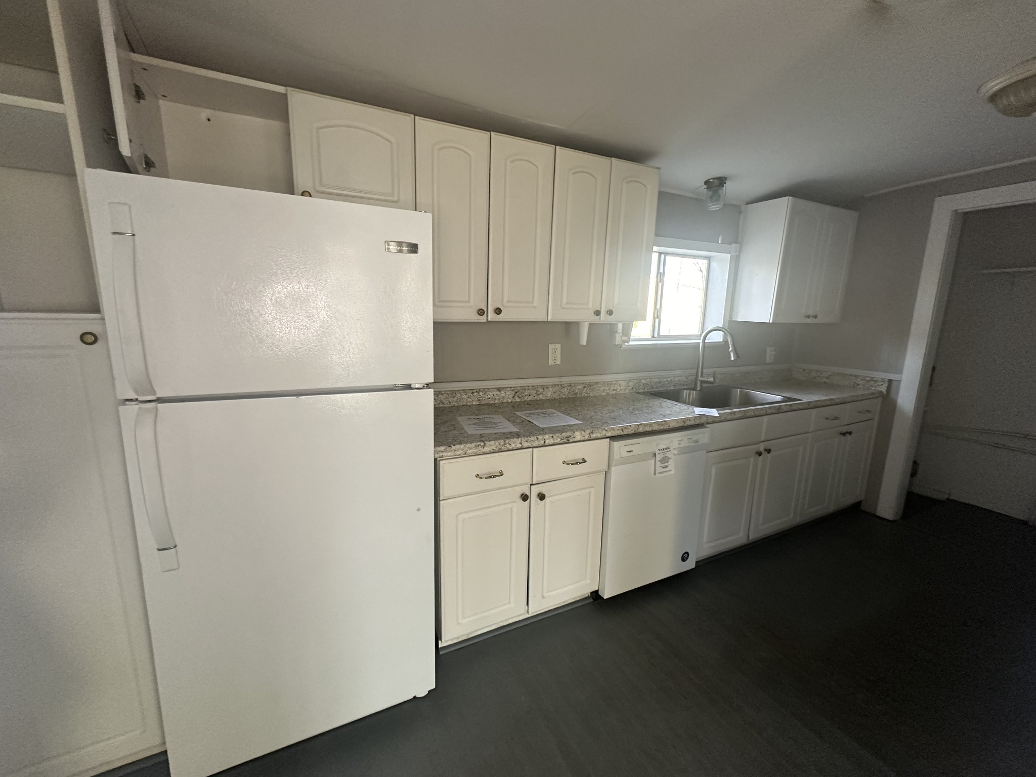 110 Main Street White Bluff, TN 37187 - Photo 5 of 9 a white refrigerator freezer sitting inside of a kitchen
