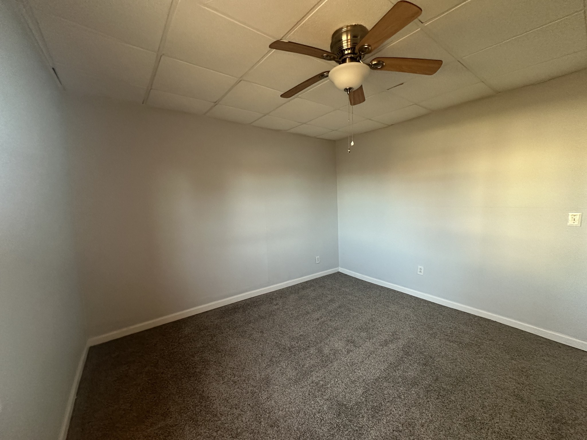 110 Main Street White Bluff, TN 37187 - Photo 8 of 9 an empty room with a fan and a ceiling fan