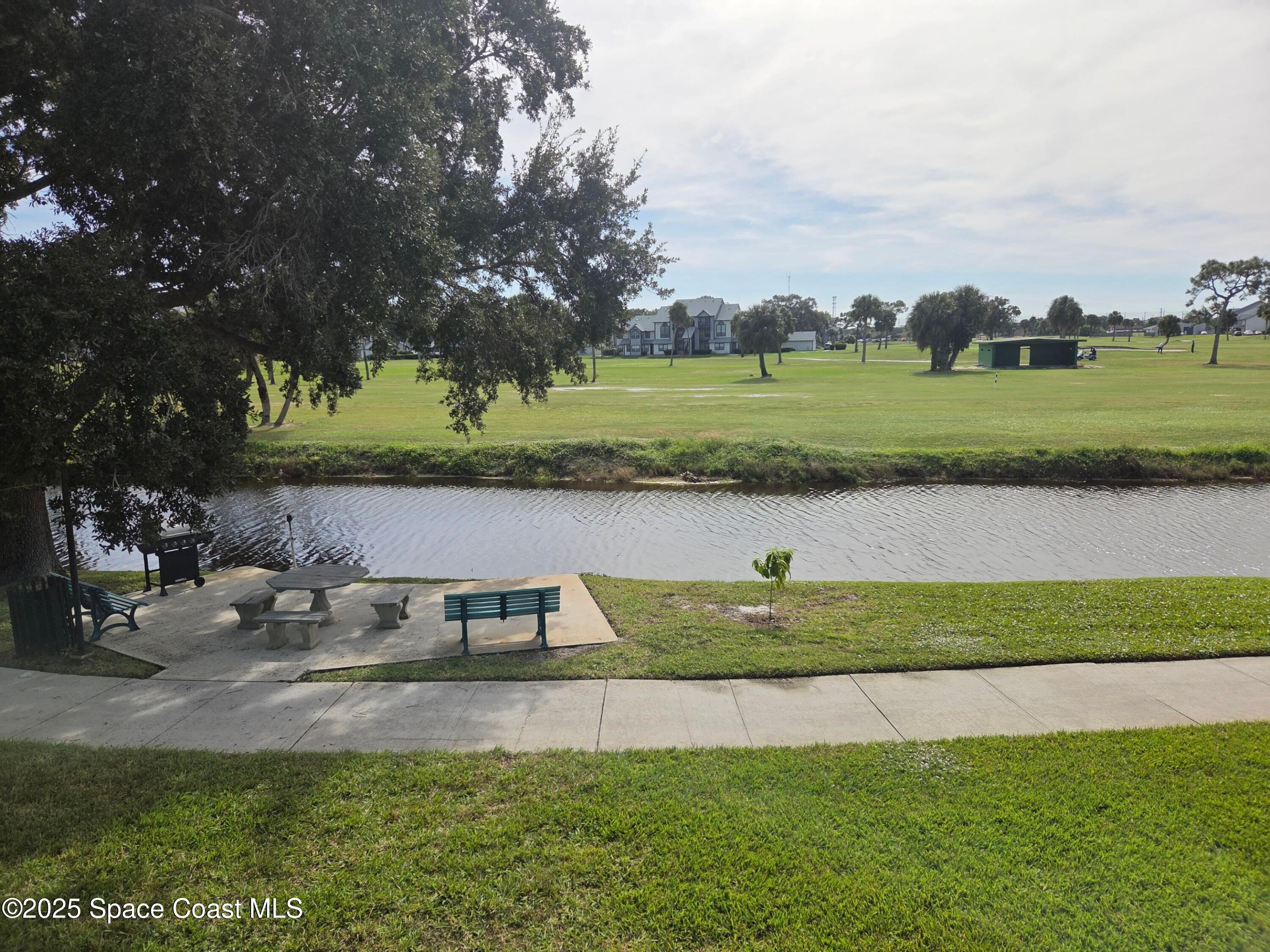 2727 North Wickham Road, Unit 20611 Melbourne, FL 32935 - Photo 5 of 10 a view of a lake with houses
