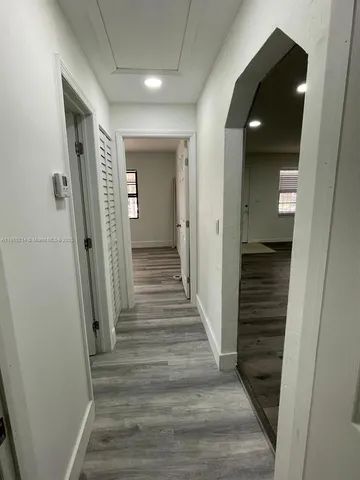 a view of an empty room with a window