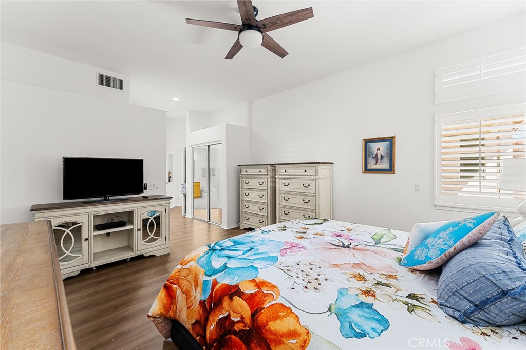 2061 Pecan Tree Street Hemet, CA 92545 - Photo 14 of 23 a bedroom with a bed and a flat screen tv
