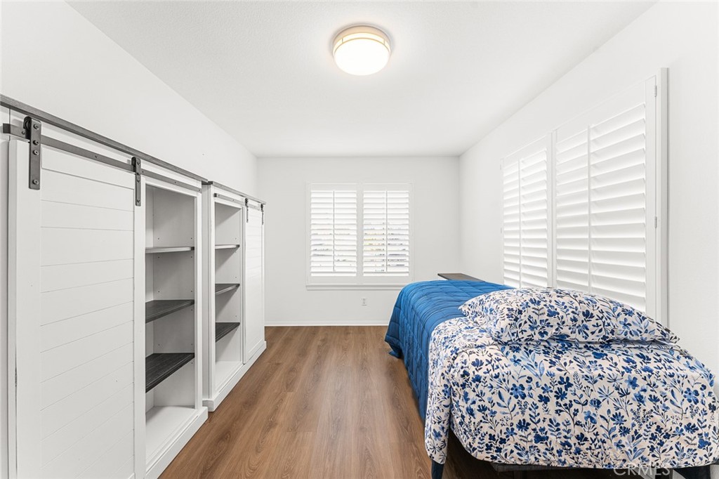 2061 Pecan Tree Street Hemet, CA 92545 - Photo 16 of 23 a bedroom with a bed and a window
