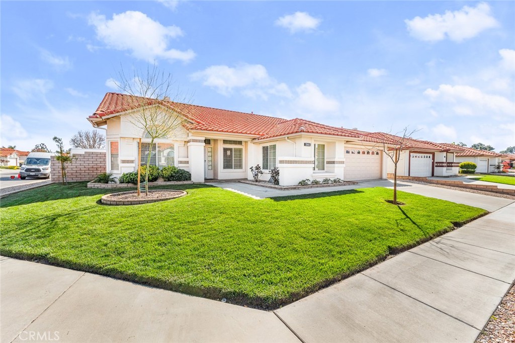 2061 Pecan Tree Street Hemet, CA 92545 - Photo 2 of 23 a view of an house with a big yard and potted plants