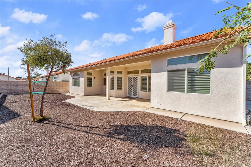 2061 Pecan Tree Street Hemet, CA 92545 - Photo 21 of 23 a front view of a house with garden