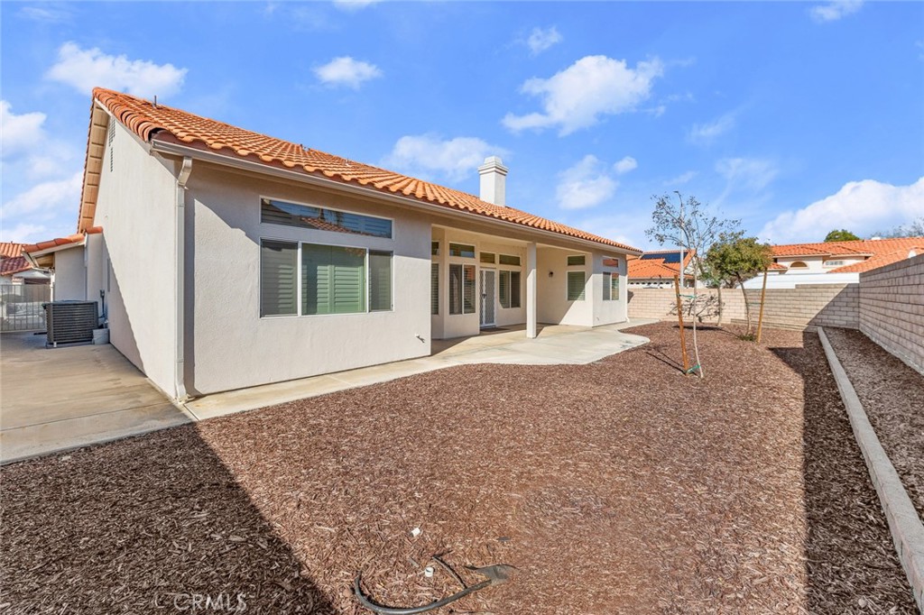 2061 Pecan Tree Street Hemet, CA 92545 - Photo 22 of 23 a view of a house with a backyard