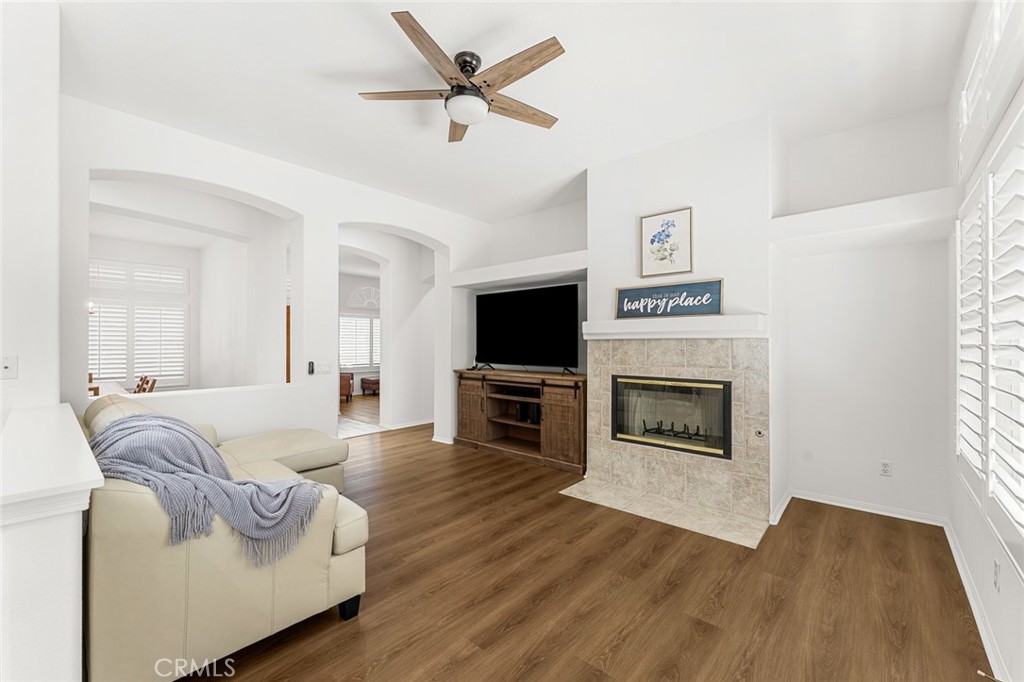 2061 Pecan Tree Street Hemet, CA 92545 - Photo 6 of 23 a living room with furniture a fireplace and a flat screen tv