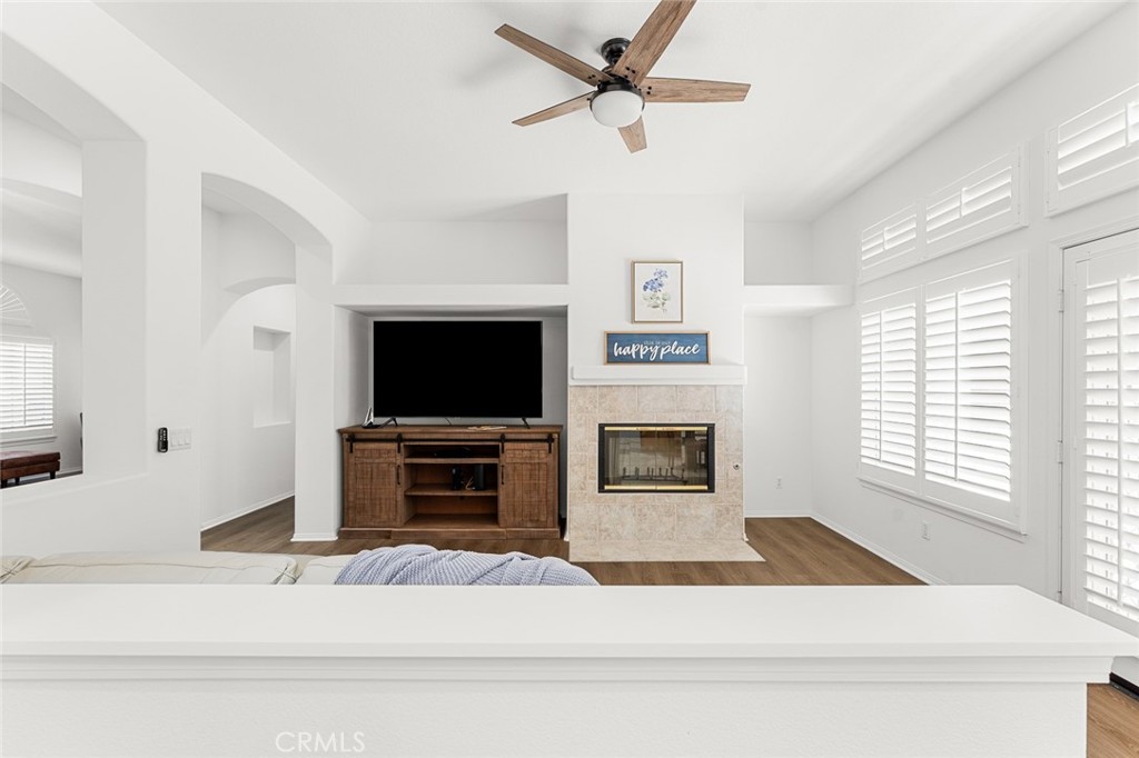 2061 Pecan Tree Street Hemet, CA 92545 - Photo 7 of 23 a living room with a fireplace and a flat screen tv