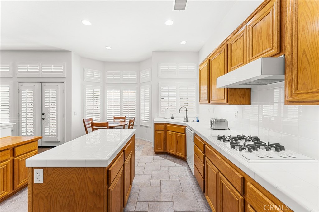 2061 Pecan Tree Street Hemet, CA 92545 - Photo 10 of 23 a kitchen with a sink a stove and a refrigerator
