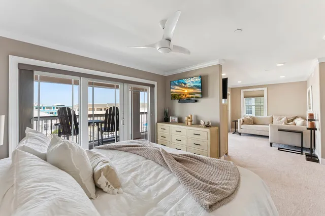 a spacious bedroom with a bed and furniture