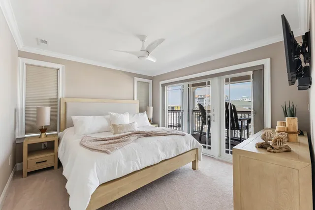 a bedroom with a bed a large window and walk in closet