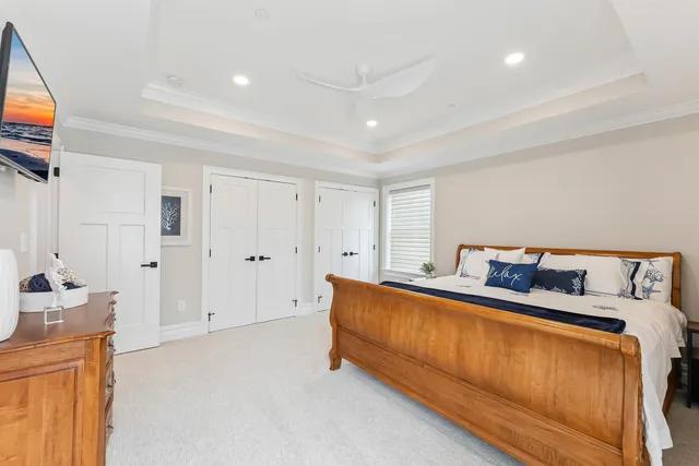 a bed room with a bed and a television