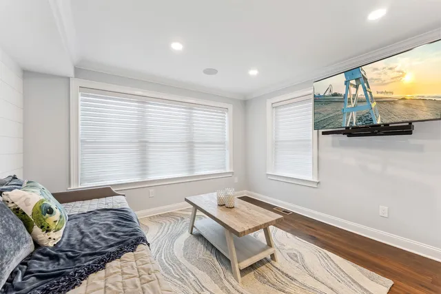 a bedroom with furniture and a window