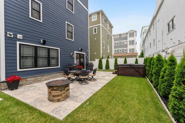 a view of a house with sitting area and garden