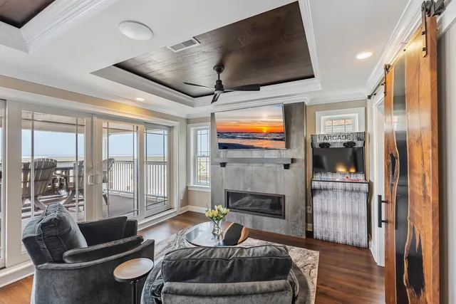 a living room with furniture and a fireplace