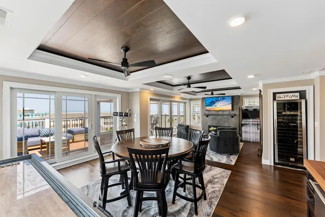 a dining room with furniture window and wooden floor