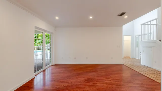 a kitchen with granite countertop a refrigerator and a sink
