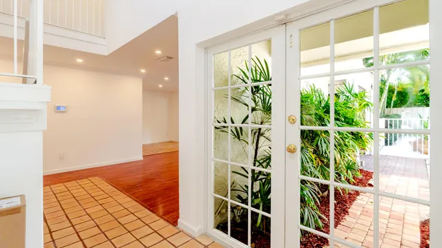 a bathroom with a sink mirror and toilet