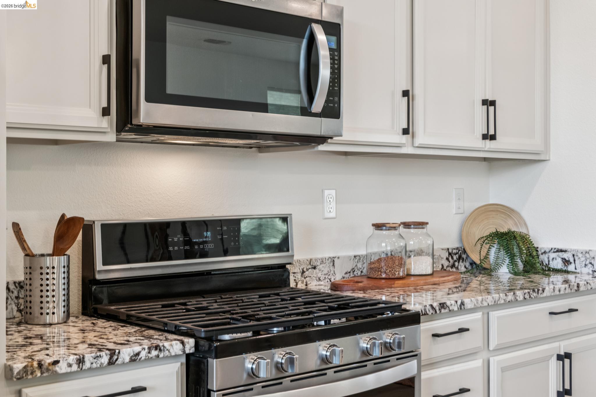 24157 Amaranth Loop Hayward, CA 94541 - Photo 26 of 63 Stainless steel gas range with an overhead microwave