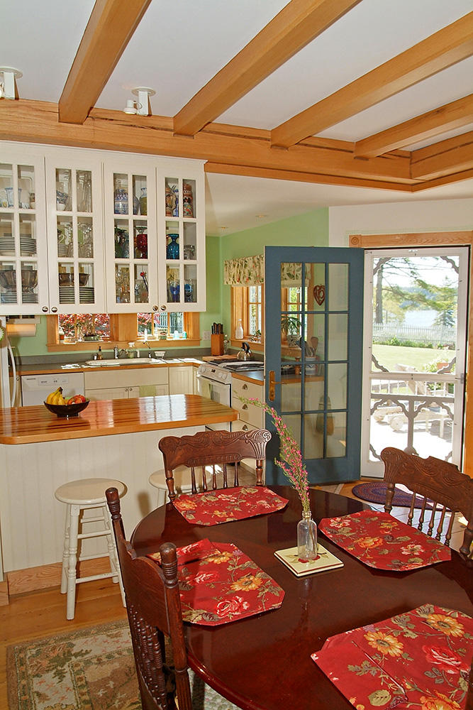 281 Salt Pond Road Blue Hill, ME 04614 - Photo 12 of 33 DR w/door to deck & kitchen beyond.