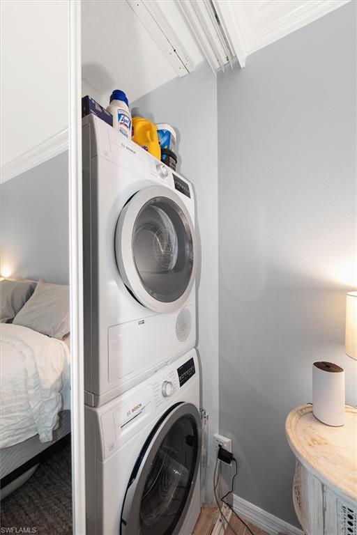 291A 8th Avenue South, Unit 291A Naples, FL 34102 - Photo 20 of 25 Laundry area featuring stacked washer / dryer