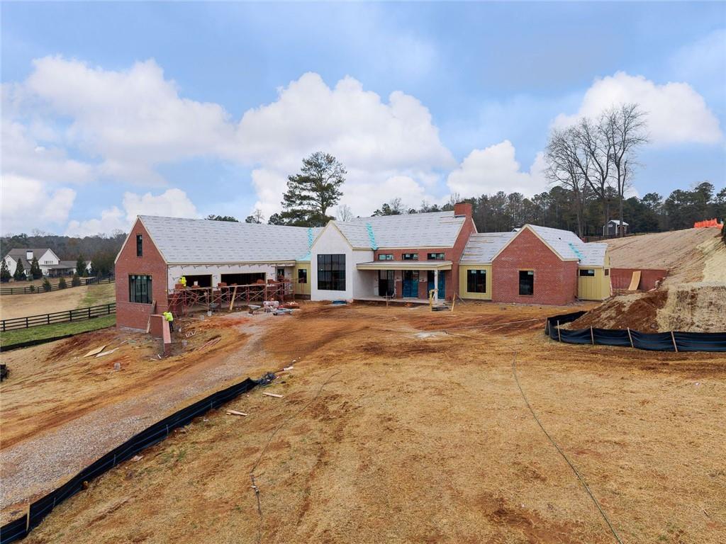 1350-a J A J Land Road Canton, GA 30115 - Photo 3 of 23 a view of a white house with a big yard and large trees