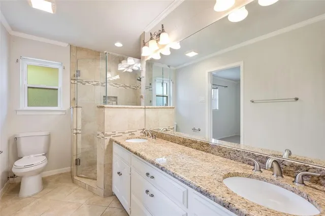 a house view with a ceiling fan and a window