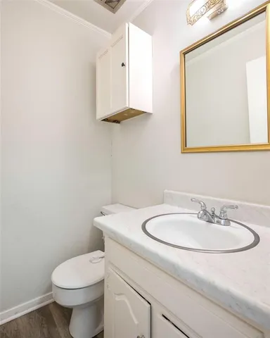 a kitchen with stainless steel appliances cabinets and a window