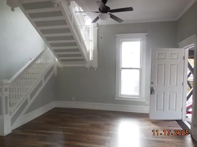 a view of an entryway with wooden floor