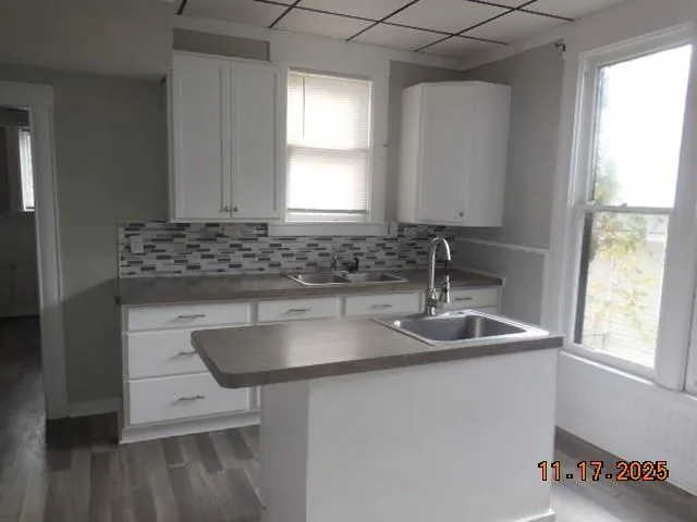 a kitchen with a sink and a window