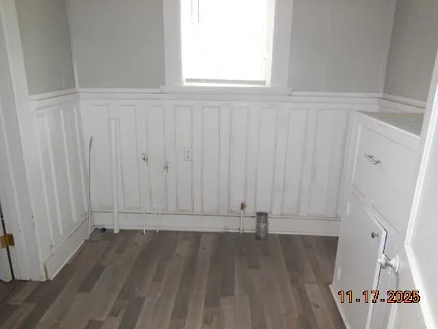 an empty room with wooden floor