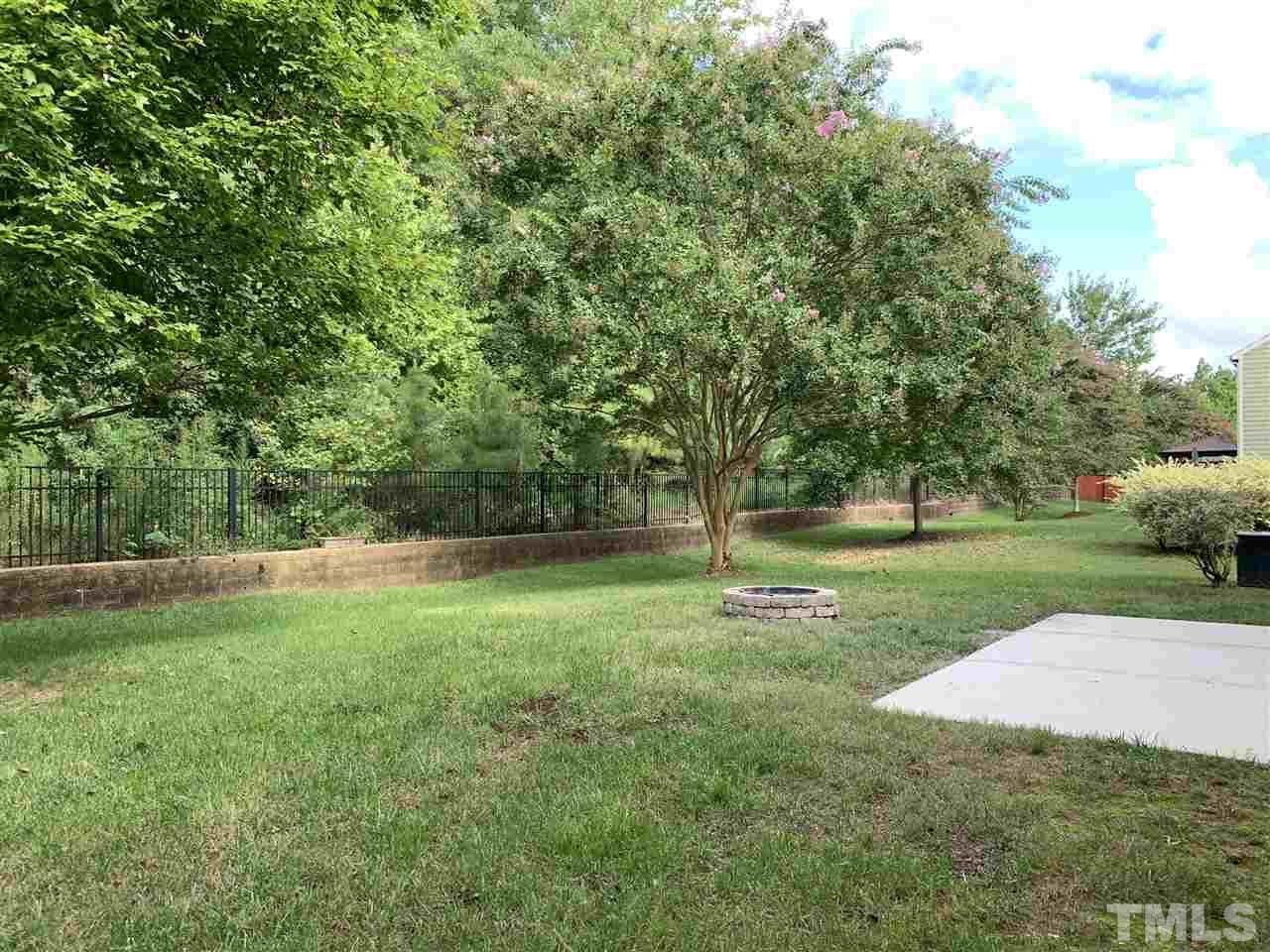 409 Amiable Loop Cary, NC 27519 - Photo 3 of 3 a view of a park with trees and plants