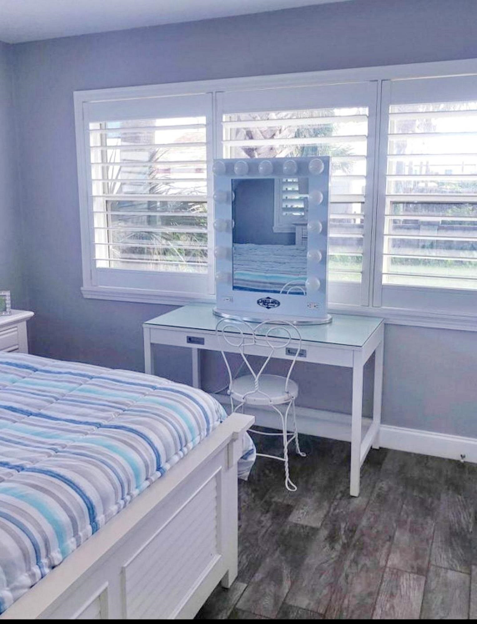 7 E Street, Unit A St. Augustine, FL 32080 - Photo 8 of 12 Bedroom with baseboards and dark wood finished floors