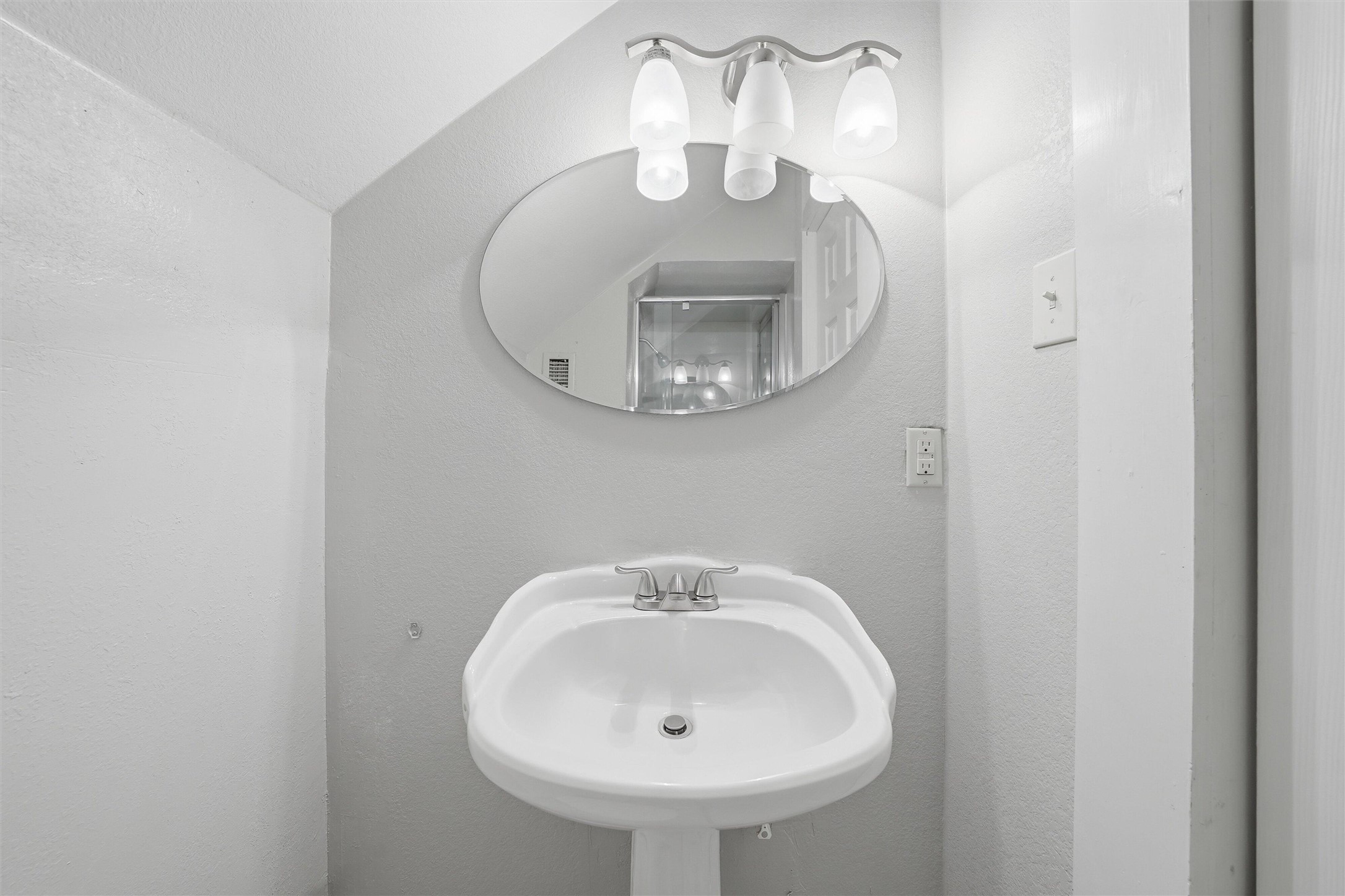 803 North 3rd Street Temple, TX 76501 - Photo 16 of 22 a bathroom with a sink and a mirror