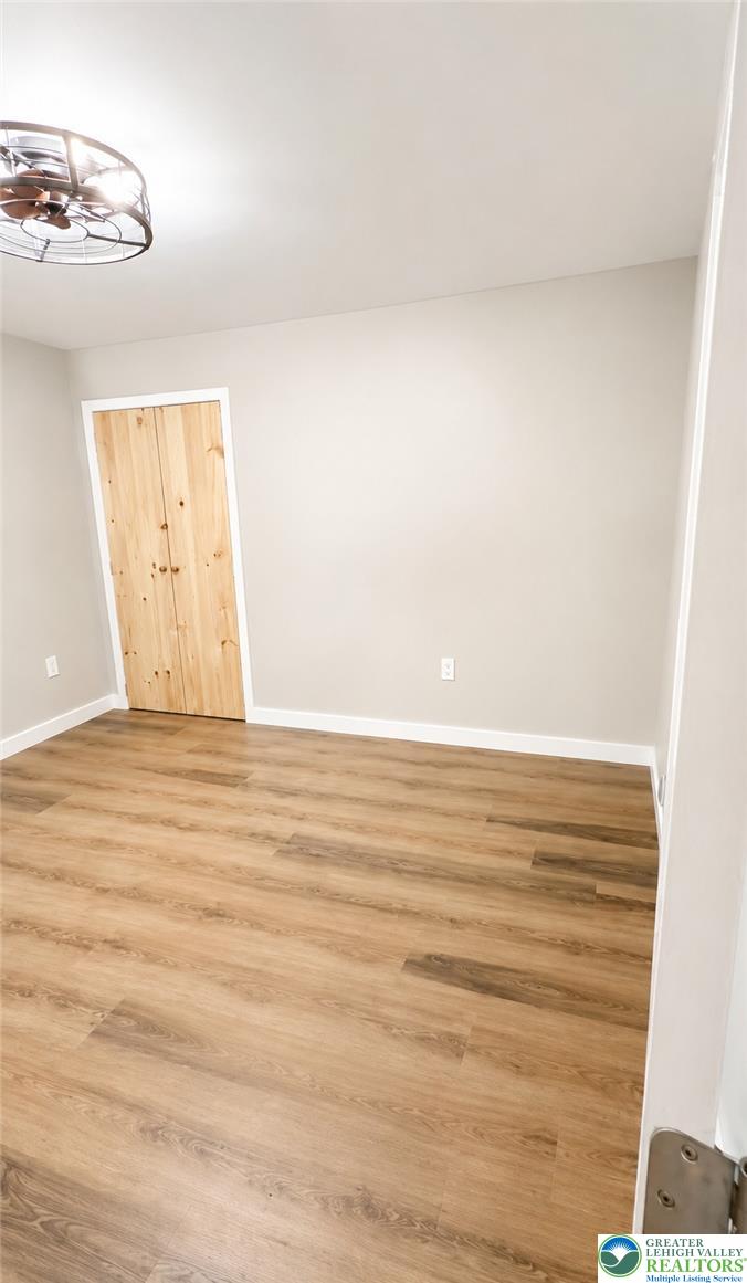182 Mountain Road Albrightsville, PA 18210 - Photo 17 of 17 A quiet bedroom featuring elegant wood flooring and a distinctive light fixture.