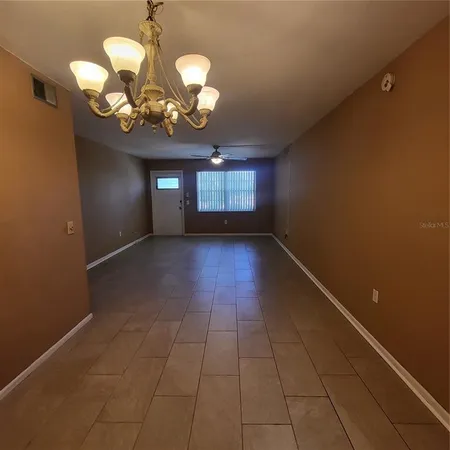a view of a room with a chandelier