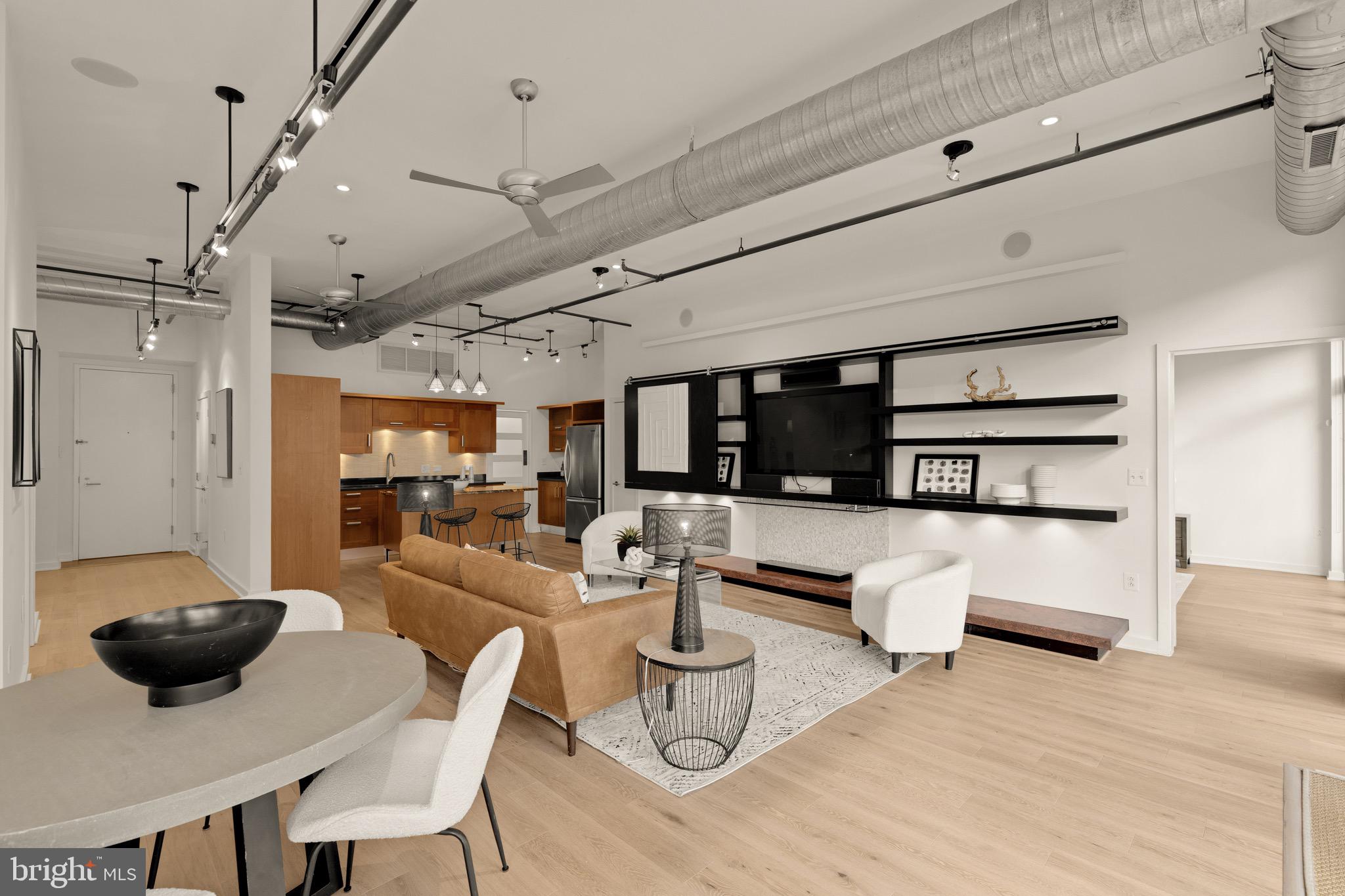 1401 Church Street Northwest, Unit 523 Washington, DC 20005 - Photo 2 of 27 a living room with furniture a rug and a large window