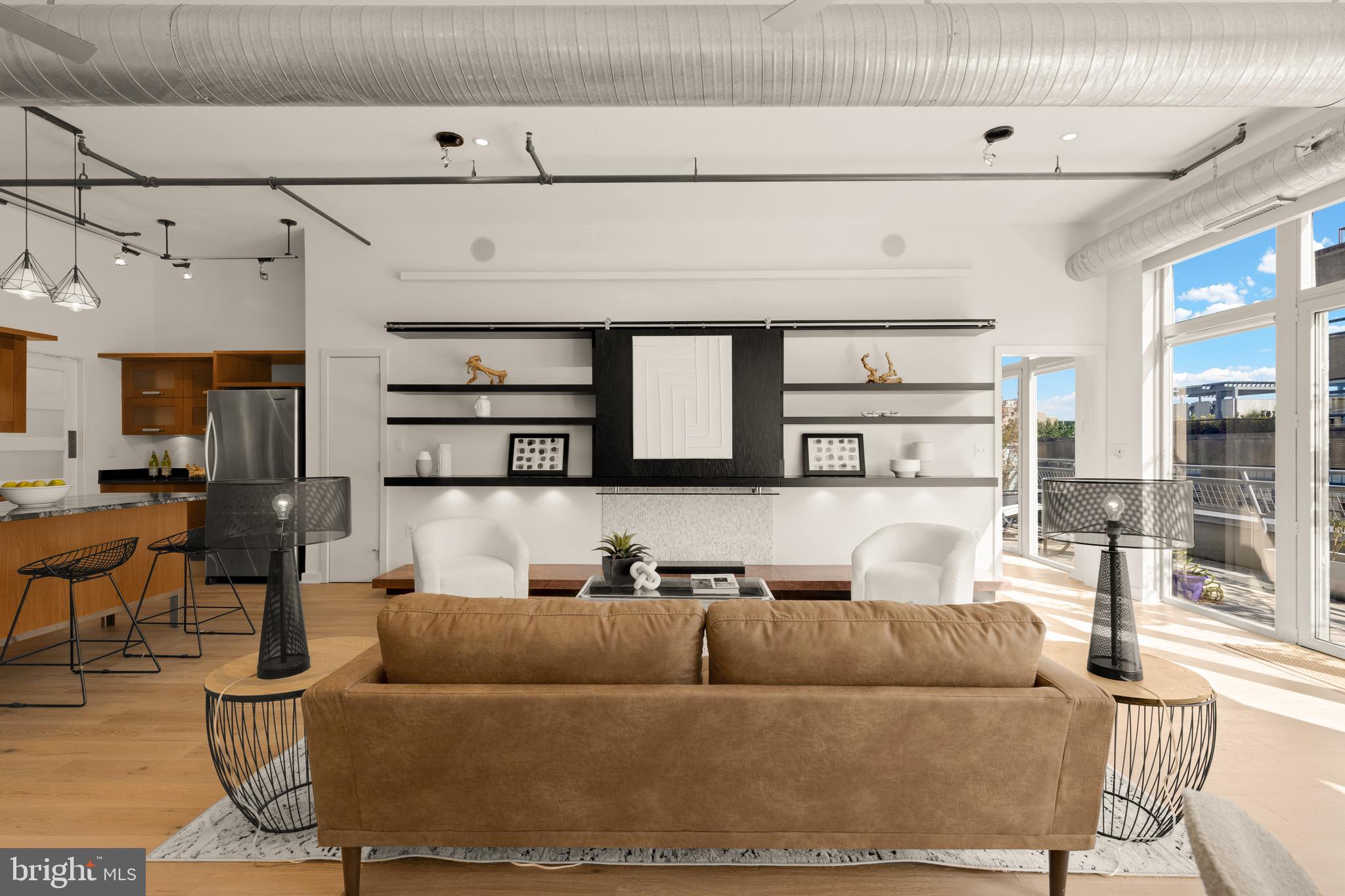 1401 Church Street Northwest, Unit 523 Washington, DC 20005 - Photo 4 of 27 a living room with furniture and a fireplace