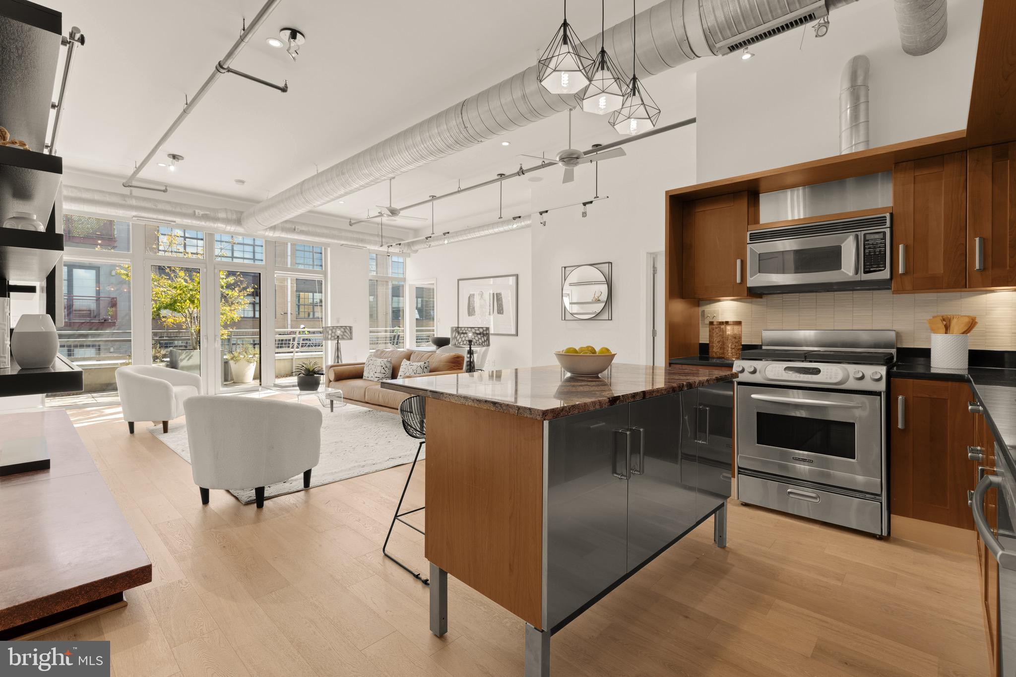 1401 Church Street Northwest, Unit 523 Washington, DC 20005 - Photo 8 of 27 a kitchen with stainless steel appliances granite countertop a stove and a sink