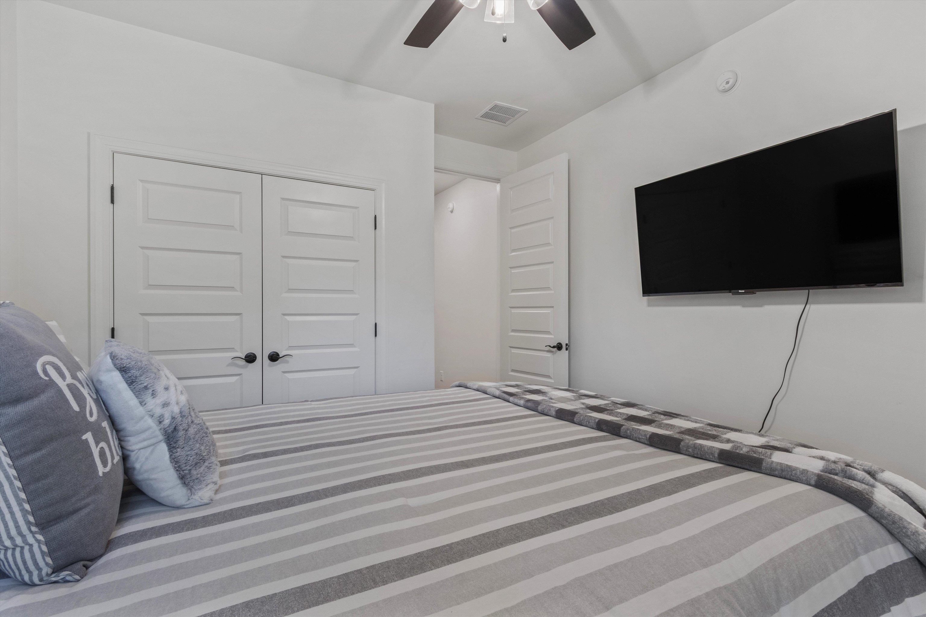 65 Watson Road Oakland, TN 38060 - Photo 22 of 40 a bedroom with a bed and a flat screen tv