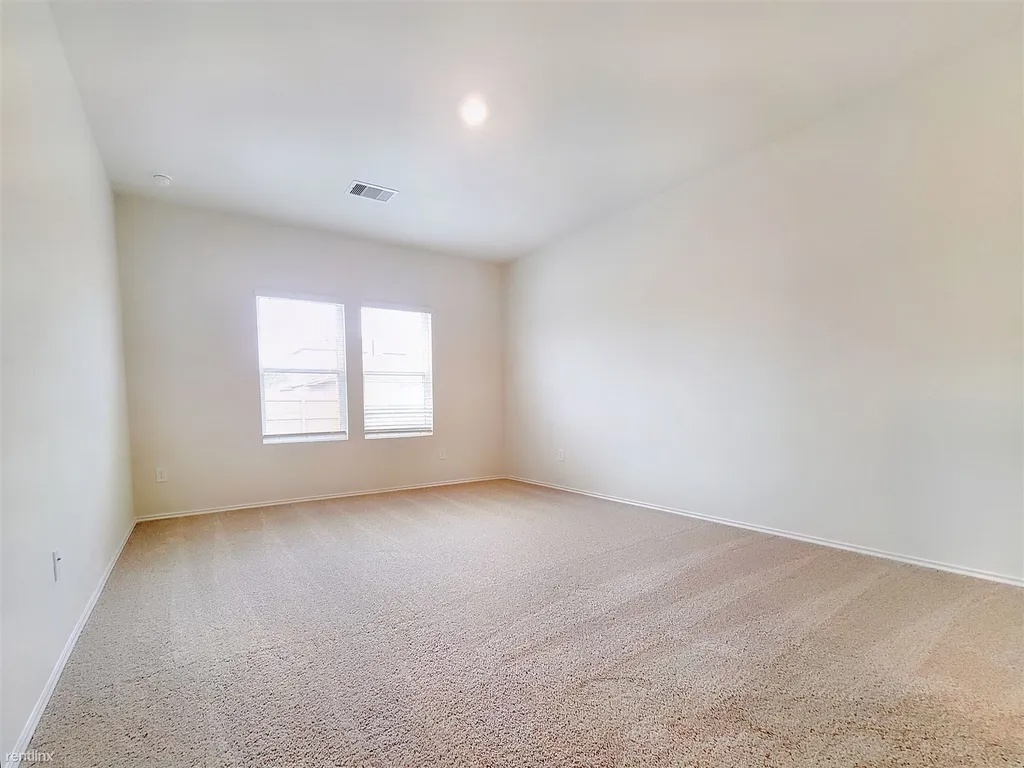 419 Sickle Loop Kyle, TX 78640 - Photo 15 of 35 A quiet retreat with plush carpeting and natural illumination awaits.