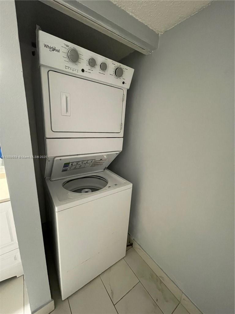 3985 West McNab Road, Unit A101 Pompano Beach, FL 33069 - Photo 7 of 13 a utility room with dryer and washer