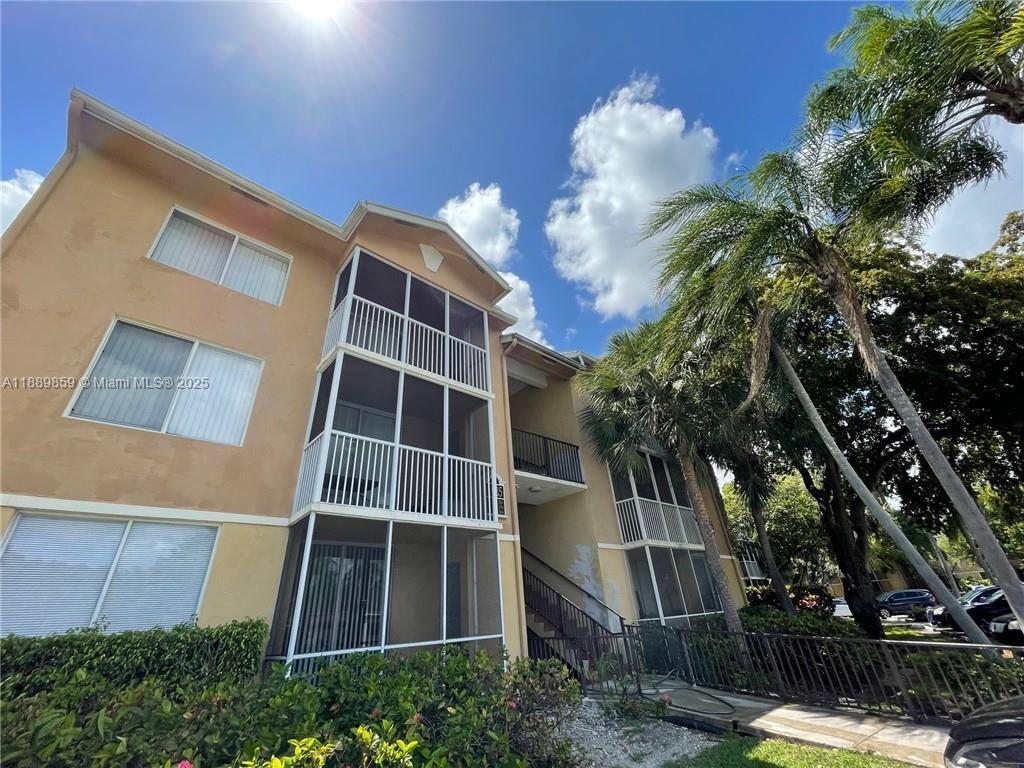 3985 West McNab Road, Unit A101 Pompano Beach, FL 33069 - Photo 9 of 13 a front view of a house