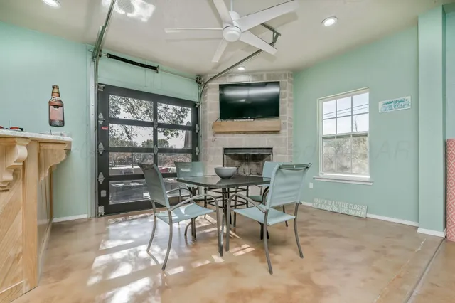 a view of a dining room with furniture window and outside view