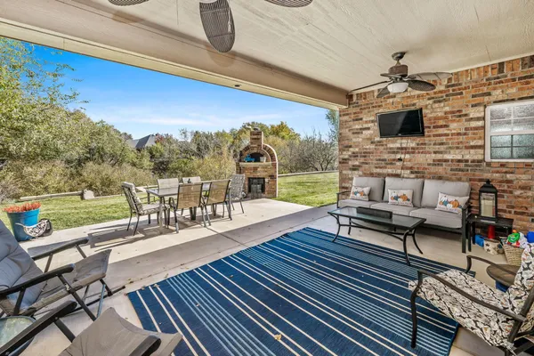a view of a lake with a table and chairs