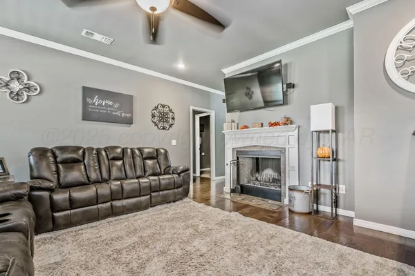 a living room with furniture and a fireplace